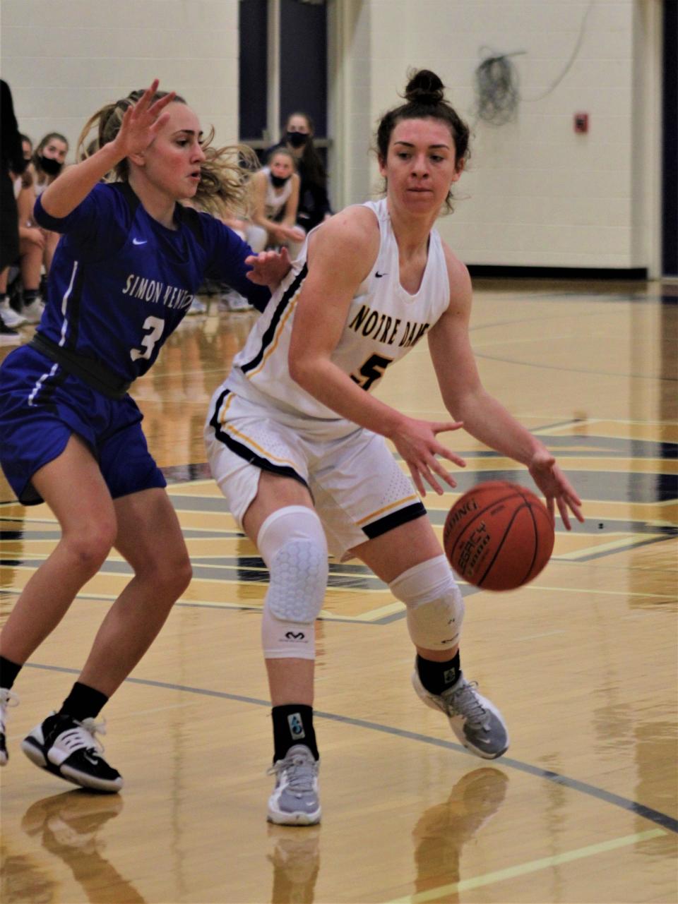 Simon Kenton senior Alexis Baker guards Notre Dame senior Macie Feldman as Notre Dame defeated Simon Kenton 68-31 in KHSAA girls basketball Jan. 5, 2022, at Notre Dame Academy, Park Hills, Ky.