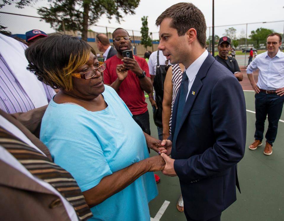 Pete Buttigieg shares a moment with Shirley Newbill during a gun violence memorial in South Bend, Indiana.