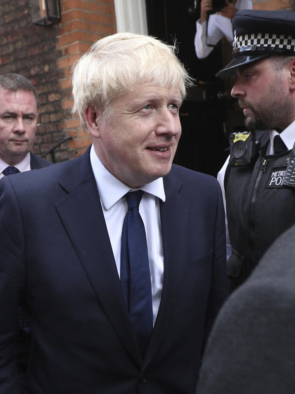 Conservative Party leadership contender Boris Johnson leaves his office in Westminster area of London, Monday July 22, 2019. Voting closes Monday in the ballot to elect Britain's next prime minister, from the two contenders Jeremy Hunt and Boris Johnson, as critics of likely winner Boris Johnson condemned his vow to take Britain out of the European Union with or without a Brexit deal.(Kirsty O'Connor/PA via AP)