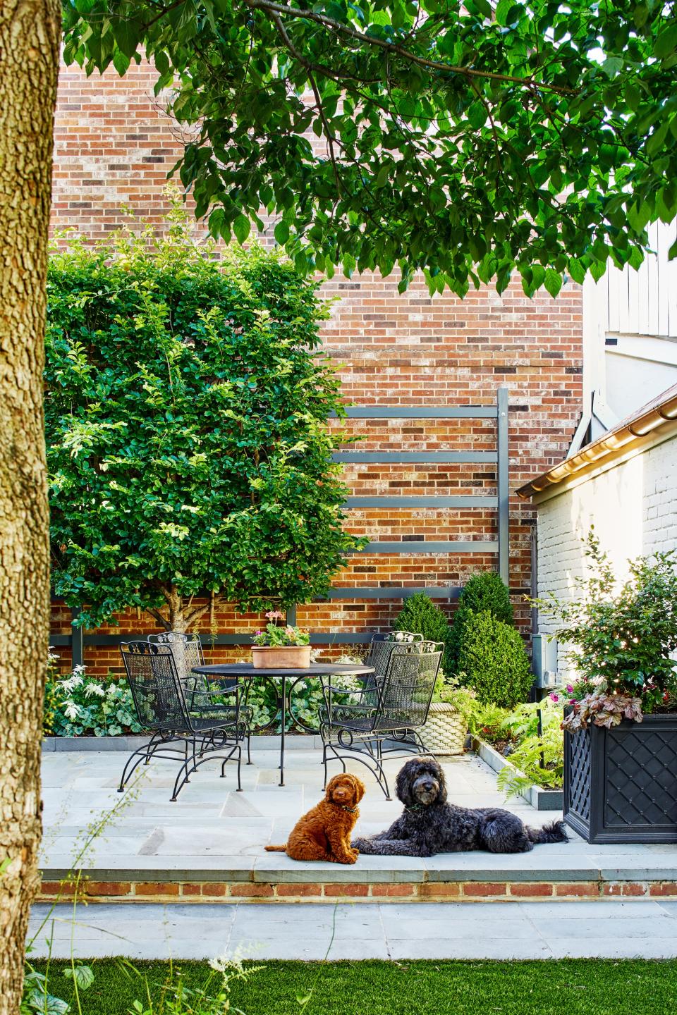 backyard patio with garden border by Joseph Richardson of Richardson & Associates Landscape Architecture