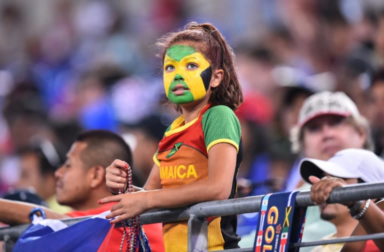 A young Jamaican fan watches Jamaica play Haiti during a CONCACAF Gold Cup quarterfinal football match in Baltimore on July 18, 2015