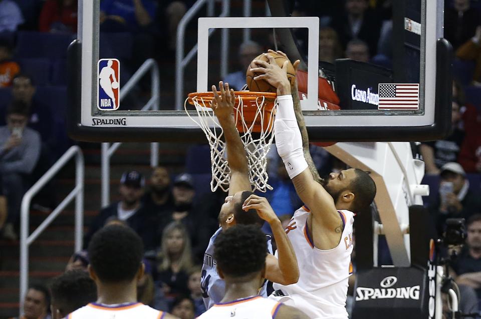 Suns center Tyson Chandler dunks the winning shot against the Grizzlies. (AP)