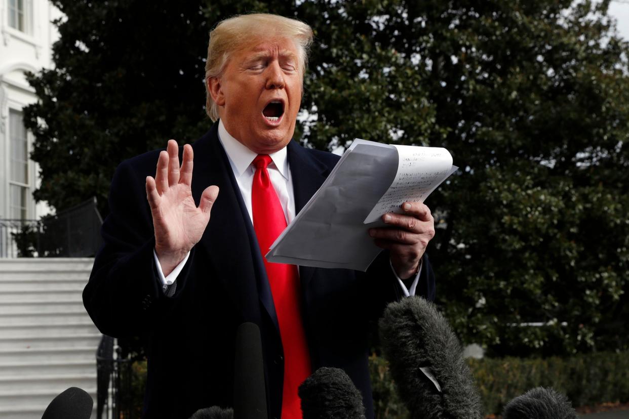 Donald Trump reads from a statement outside the White House in reaction to the impeachment evidence of Gordon Sondland: AP