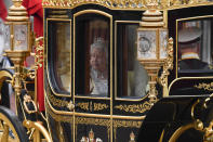 Britain's Queen Elizabeth II travels in a carriage to parliament for the official State Opening of Parliament in London, Monday, Oct. 14, 2019. (AP Photo/Alberto Pezzali)