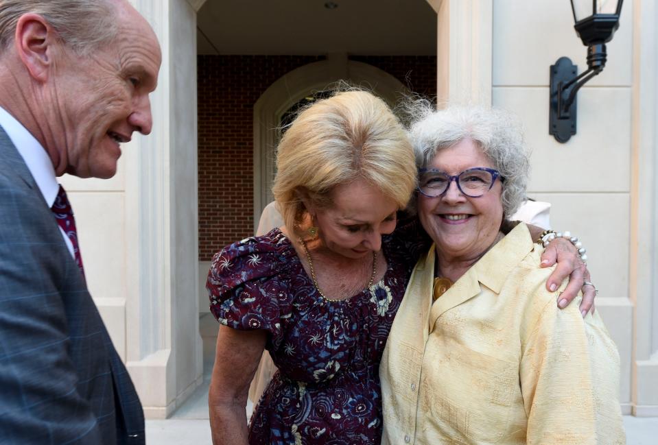 Sep 14, 2022; Tuscaloosa, AL, USA; The University of Alabama officially cut the ribbon on the new Julia Tutwiler Hall, a dormitory for freshmen women, that replaces the old Tutwiler Hall. UA System Trustee Karen Brooks hugs Netta Tutwiler Holley, the great great niece of Julia Tutwiler as she and UA President Stuart Bell greet her after the ceremony. Mandatory Credit: Gary Cosby Jr.-Tuscaloosa News