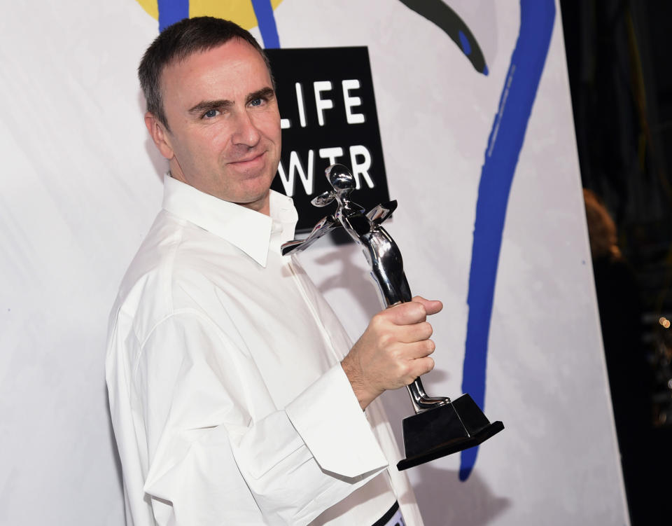 FILE - In this Monday, June 5, 2017, file photo, Raf Simons, winner of the awards for menswear designer of the year and womenswear designer of the year, poses in the press room at the CFDA Fashion Awards at the Hammerstein Ballroom in New York. Designer Raf Simons is parting ways with Calvin Klein after two years with the fashion company. Calvin Klein announced in a statement Friday, Dec. 21, 2018 the Belgian designer's departure as the chief creative officer was amicable. The company said it decided on a new brand direction different from Simons' creative vision.(Photo by Evan Agostini/Invision/AP, File)