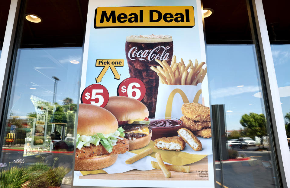 BURBANK, CALIFORNIA - JULY 22, 2024: A sign advertising meal bundles hangs inside a McDonald's restaurant in Burbank, California. McDonald's is extending its $5 meal bundles to most U.S. locations after an initial four-week period, and the fast-food icon says the bundles are bringing customers back to its restaurants. (Photo by Mario Tama/Getty Images)