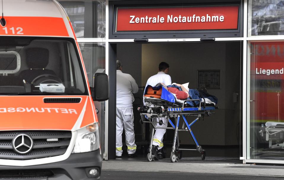 In this Tuesday, Feb. 12, 2019 photo, a patient is taken to the emergency room of the University Medical Center in Duesseldorf. The German hospital placed advertisements in Polish newspapers in the UK to hire Polish nurses who may leave the United Kingdom because of the Brexit. (AP Photo/Martin Meissner)