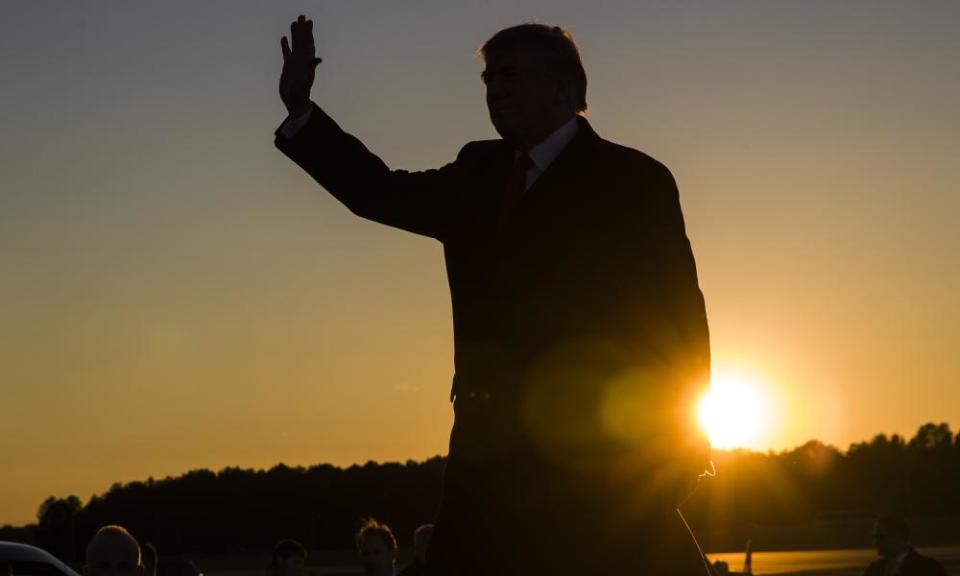Donald Trump waves as he arrives to speak in Tupelo, Mississippi, in November.