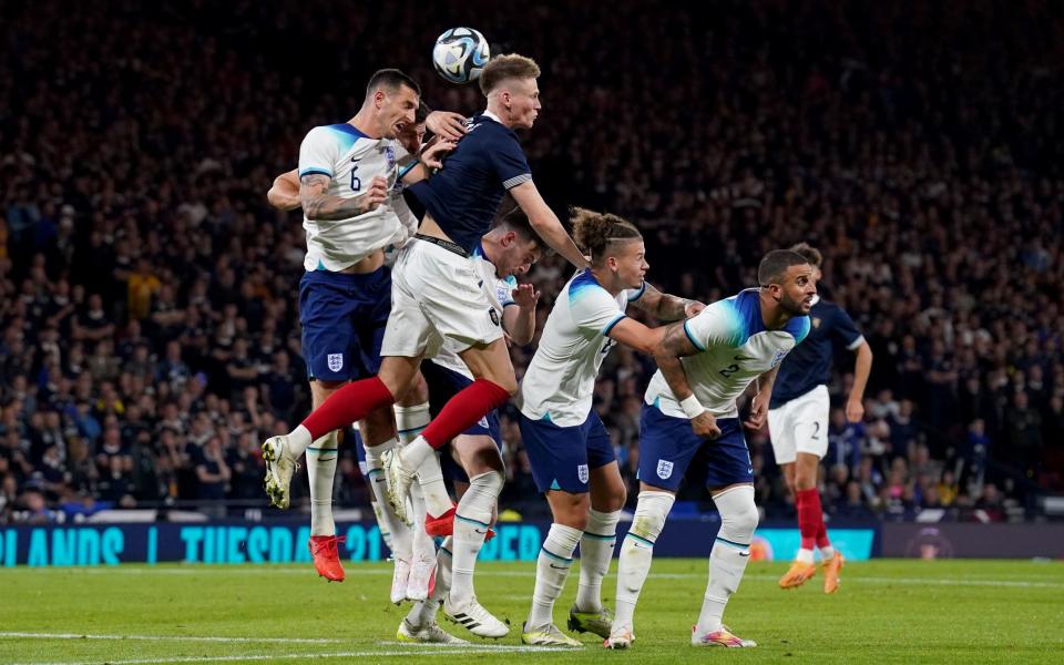 Englandâs Lewis Dunk battles for the ball with Scotlandâs Scott McTominay during the international friendly match at Hampden Park