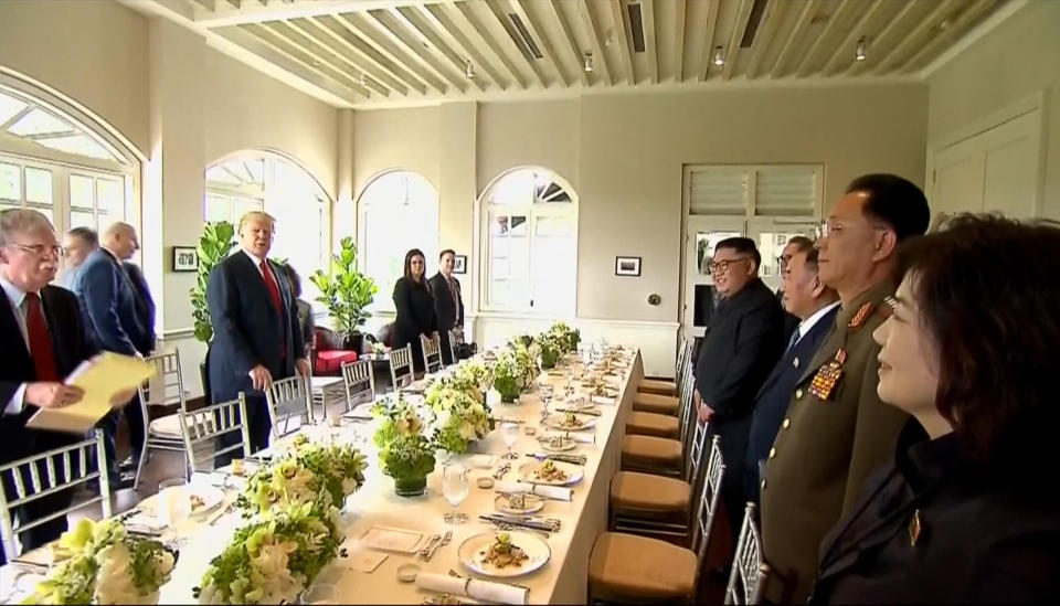 Donald Trump and Kim Jong Un at their lunch at Capella Hotel on 12 June 2018. (PHOTO: AP)