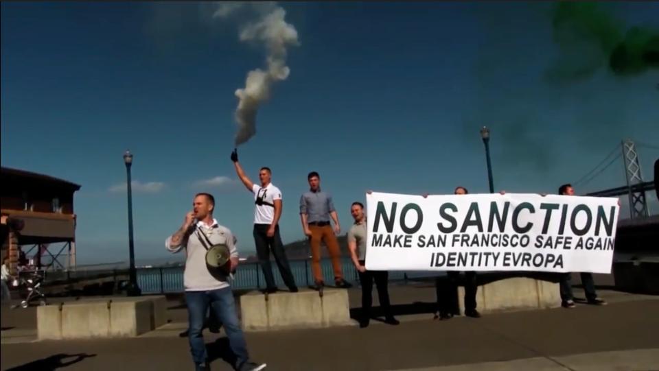 McCaffrey holds a banner during an Identity Evropa anti-immigrant demonstration in San Francisco in October 2016. (Photo: YouTube)