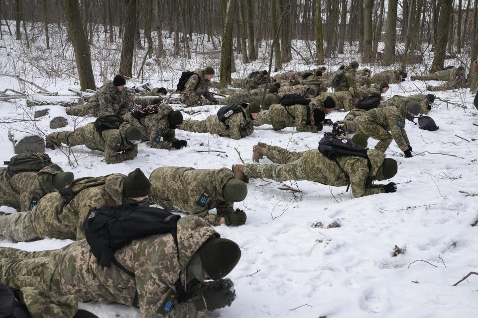 Members of Ukraine's Territorial Defense Forces, volunteer military units of the Armed Forces, train in a city park in Kyiv, Ukraine, Saturday, Jan. 22, 2022. Dozens of civilians have been joining Ukraine's army reserves in recent weeks amid fears about Russian invasion. (AP Photo/Efrem Lukatsky)