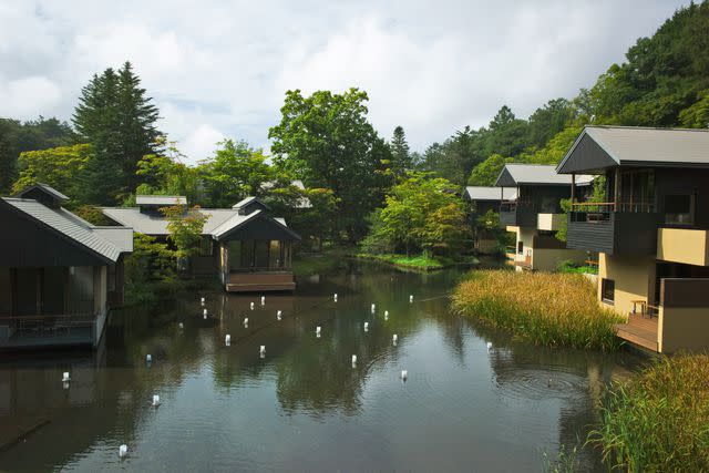 <p>Max Houtzager</p> Lanterns on the river that flows through the Hoshinoya resort.