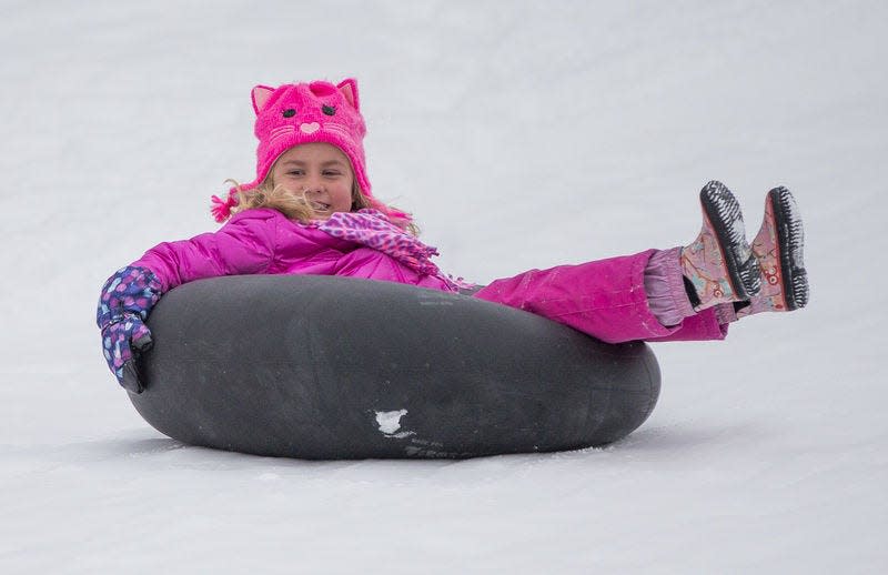 Caroline Smith, 5, tubes down a hill at St. Patrick's County Park in South Bend in 2021.