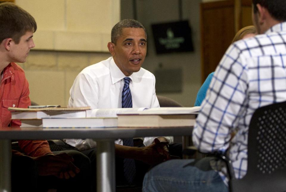 President Barack Obama participates in a roundtable discussion with students at the University of Iowa, Wednesday, April 25, 2012, in Iowa City, Iowa. At left is Blake Anderson. (AP Photo/Carolyn Kaster)