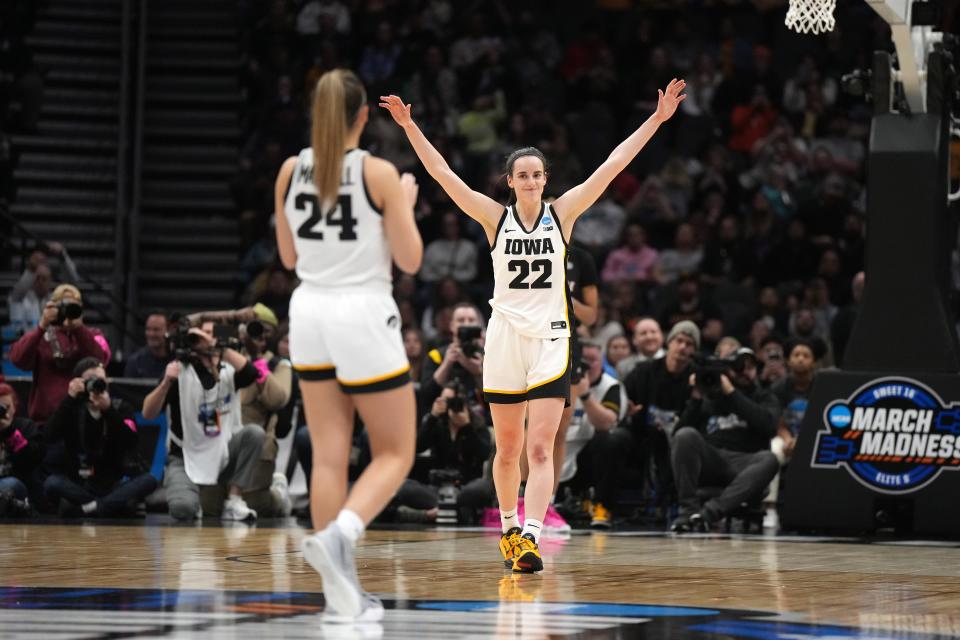 Caitlin Clark celebrates during Iowa's Elite Eight win against Louisville.