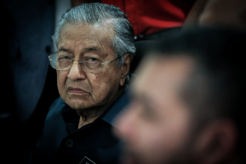 Tun Dr Mahathir Mohamad said that Prime Minister Tan Sri Muhyiddin Yassin’s administration will never convict the six Umno MPs being charged in court for corruption because he needs the numbers to remain in power. — Picture by Hari Anggara