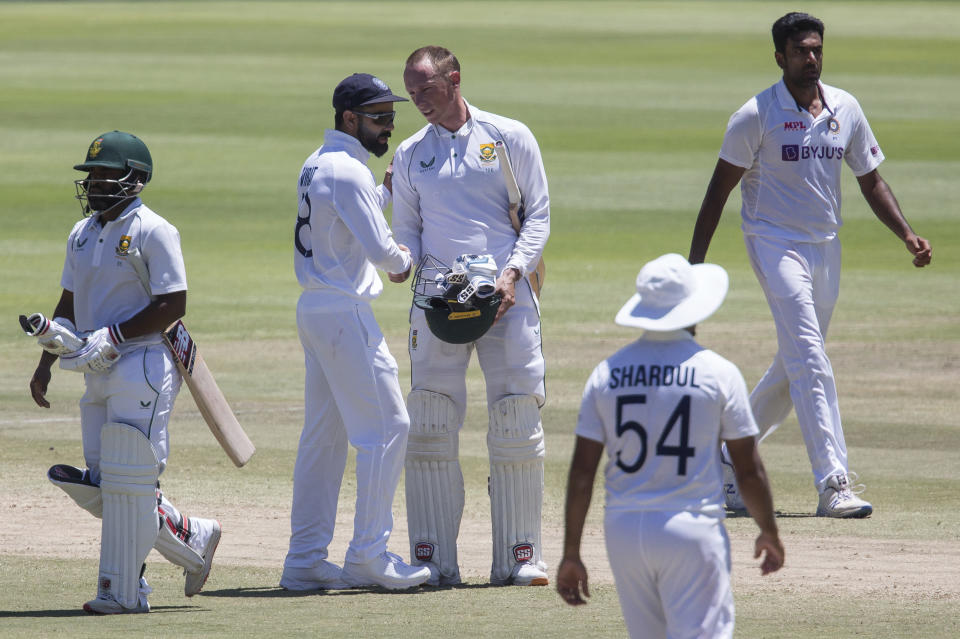 Indian captain Virat Kohli congratulates Rassie van Der Dussen oafter South Africa beat India 2-1 in a test series between in Cape Town, South Africa, Friday, Jan. 14, 2022. (AP Photo/Halden Krog)