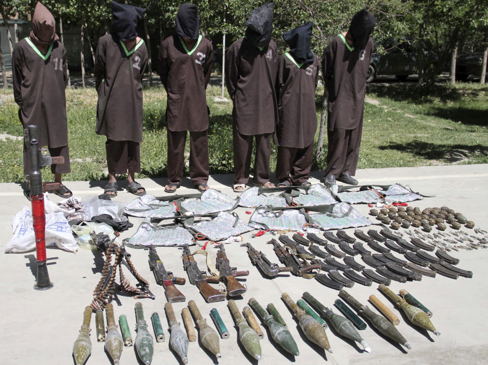 FILE - In this May, 30, 2013 file photo, insurgents suspected of being from the Haqqani network are presented to the media at the National Directorate of Security headquarters in Kabul, Afghanistan. Although the Taliban had promised Washington during months of negotiations that the U.S. will never again be attacked from Afghan soil, there's no evidence of a break in relations between long-time allies the Taliban and al-Qaida. (AP Photo, file)