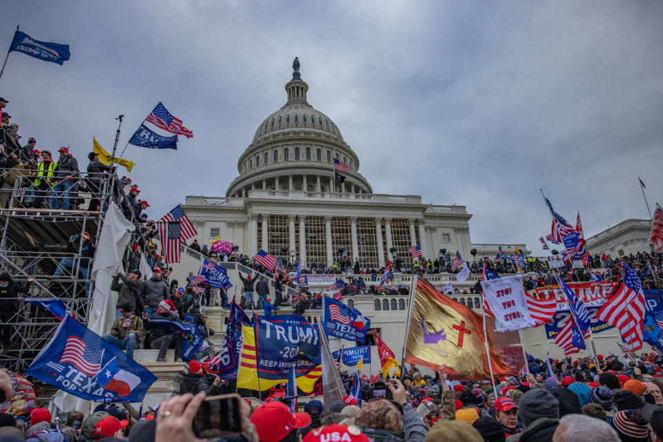 WASHINGTON,DC-JAN6: Supporters of President Trump storm the United States Capitol building.  (Photo by Evelyn Hockstein/For The Washington Post via Getty Images)