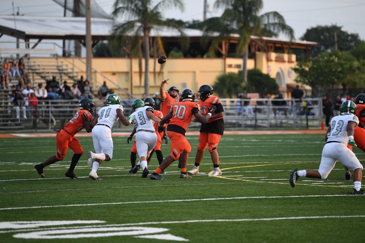 Lakeland's Zach Pleuss attempts a pass vs. Venice in a spring contest. Pleuss threw for three touchdowns and his team won 31-24.