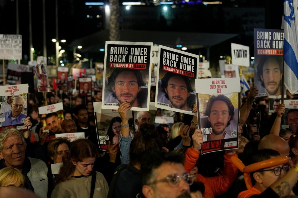 Friends and relatives of the Israeli hostages held in the Gaza Strip by the Hamas militant group attend a rally calling for their release Saturday, Dec. 9, 2023, in Tel Aviv, Israel.