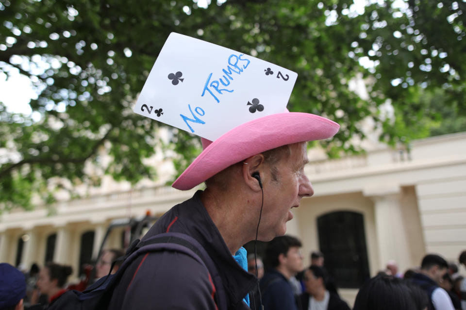 A protester wearing a 'No Trumps' hat on The Mall in London during the first day of the US President Donald Trump's state visit to the UK.