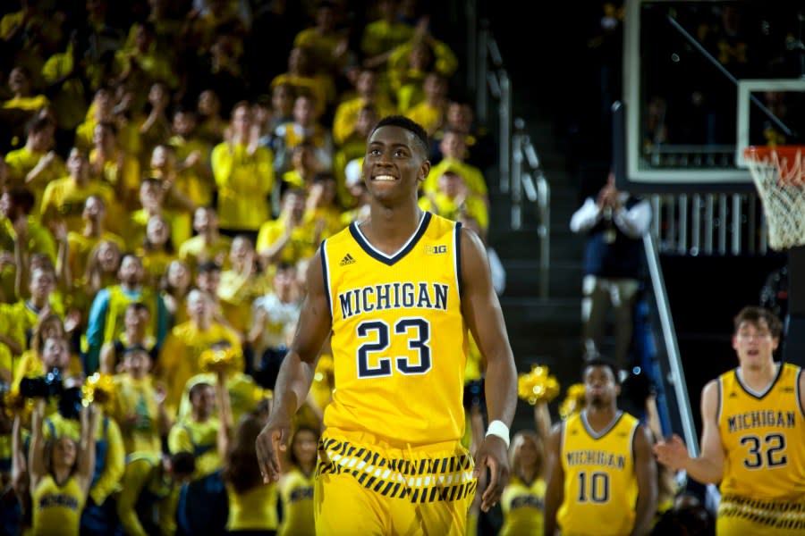 Michigan guard Caris LeVert (23) reacts after making a three point basket in the second half of an NCAA college basketball game against Xavier at Crisler Center in Ann Arbor, Mich., Friday, Nov. 20, 2015. Xavier won 86-70. (AP Photo/Tony Ding)