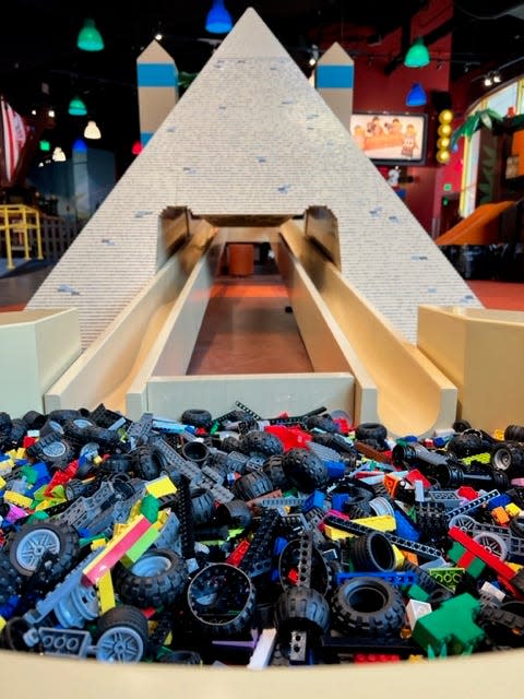 Guests can build LEGO vehicles and race against others at LEGO Discover Center Atlanta.