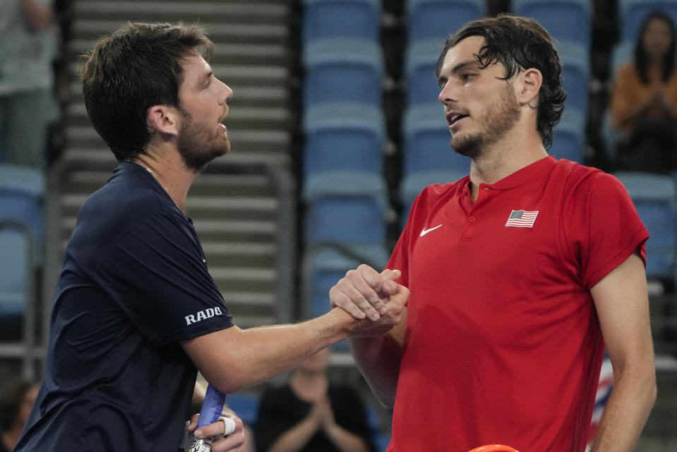 Britain's Cameron Norrie, left, is congratulated by United States' Taylor Fritz following their match at the United Cup tennis event in Sydney, Australia, Wednesday, Jan. 4, 2023. (AP Photo/Mark Baker)