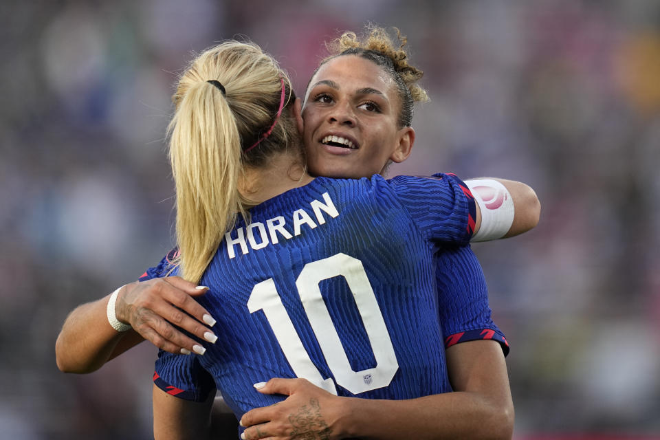 United States' Lindsey Horan (10) embraces teammate Trinity Rodman after scoring a goal during the first half of the CONCACAF Gold Cup women's soccer tournament final match against Brazil, Sunday, March 10, 2024, in San Diego. (AP Photo/Gregory Bull)