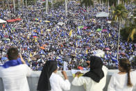 FILE - Thousands of people congregate outside Managua's Cathedral during a "Peace and Justice" rally called by the Catholic Church, in Managua, Nicaragua, April 28, 2018. When a social security reform in 2018 triggered massive protests backed by businesspeople, Catholic leaders and other sectors, President Daniel Ortega asked the church to serve as mediator in peace talks, though they ultimately failed. The Nicaraguan church has been notably sympathetic toward the protesters and their cause.(AP Photo/Alfredo Zuniga, File)