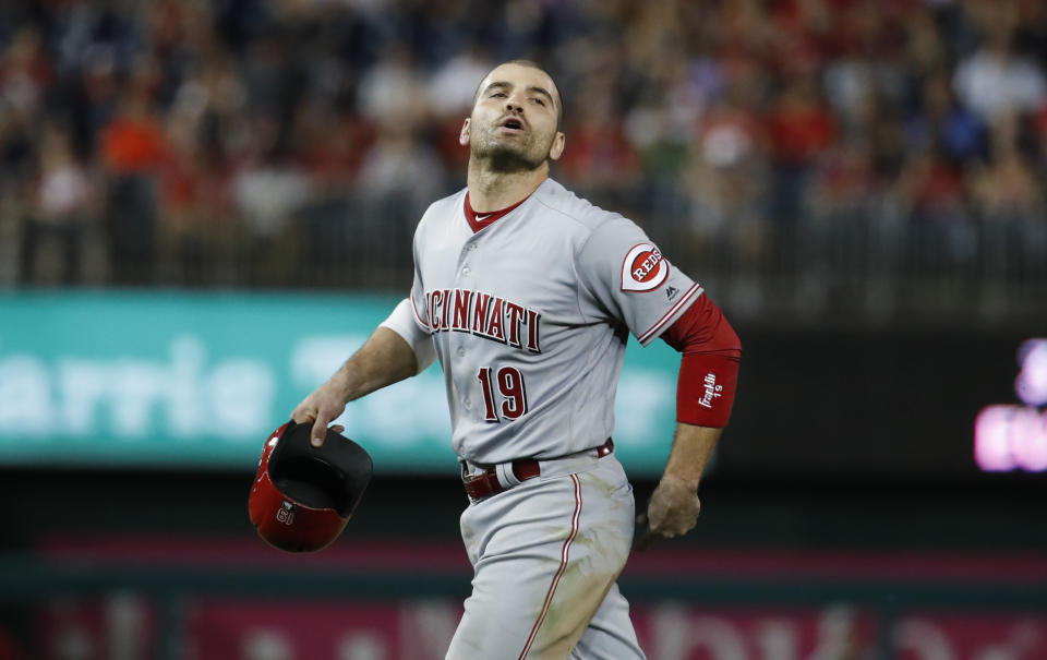 Cincinnati Reds' Joey Votto yells to the Washington Nationals' dugout as he walks off the field during the eighth inning of the second baseball game of a doubleheader at Nationals Park, Saturday, Aug. 4, 2018, in Washington. Votto was hit by a pitch after Washington Nationals' Bryce Harper and Spencer Kieboom were hit by pitches. The Nationals won 6-2. (AP Photo/Alex Brandon)