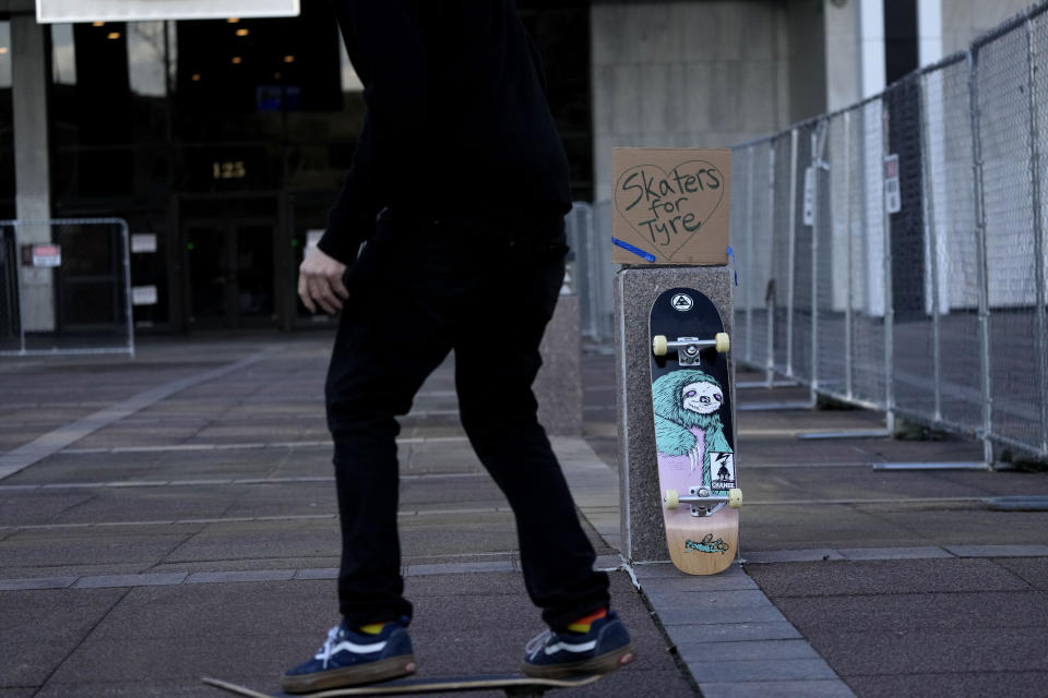 Skateboarders skate in front of city hall in remembrance of Tyre Nichols, who died after being beaten by Memphis police officers, five of whom have been fired, in Memphis, Tenn., Monday, Jan. 23, 2023. Tyre was a member of the skateboarding community, and they gathered at the request of Tyre's family to honor him. (AP Photo/Gerald Herbert)