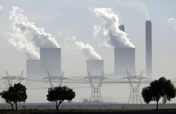 FILE - Smoke billows from the chimneys at the coal-fired Lethabo power station in Vereeniging, South Africa, on Dec. 5, 2018. Africa has contributed relatively little to the planet's greenhouse gas emissions but has suffered some of the heaviest impacts of climate change and the reverberations of human-caused global warming will only get worse, according to a new United Nations report released Feb. 28, 2022. (AP Photo/Themba Hadebe, File)