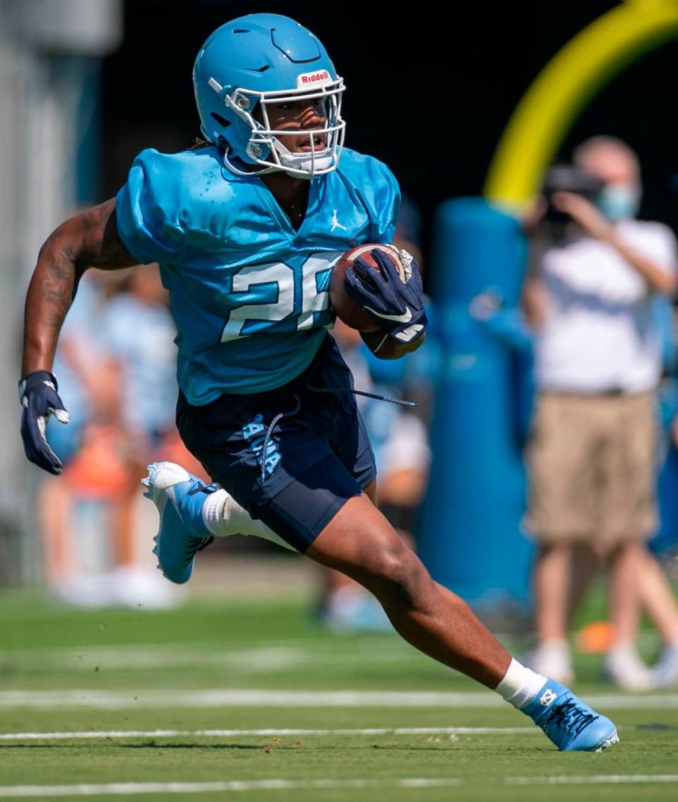 North Carolina running back D.J. Jones (26) carries the ball during the Tar Heels’ first day of practice on Thursday, August 5, 2021 in Chapel Hill N.C.