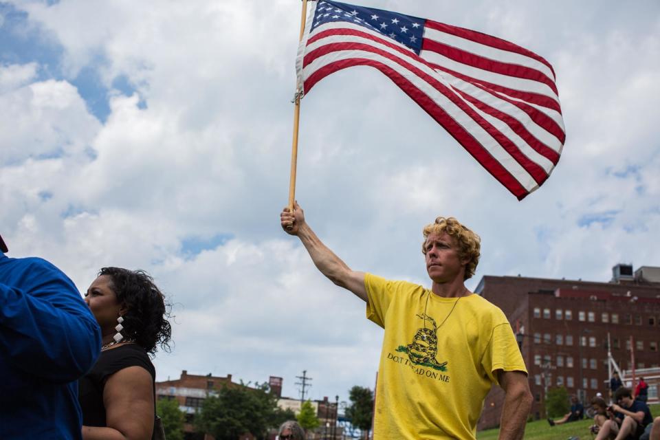 A man wearing a Gadsden flag shirt at a pro-Trump 'America First' rally in 2016 (Stefan Jeremiah/Shutterstock)