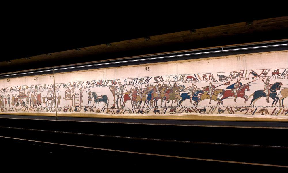 The Bayeux Tapestry, which depicts the Battle of Hastings on display at Bayeux Town Hall.