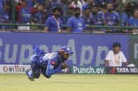 Mumbai Indians' Tilak Varma takes a catch to dismiss Delhi Capitals' Shai Hope during the Indian Premier League cricket match between Delhi Capitals and Mumbai Indians in New Delhi, India, Saturday, April 27, 2024. (AP Photo/ Surjeet Yadav)