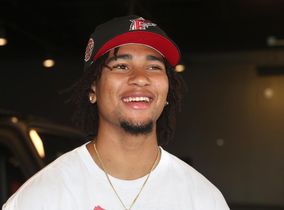 Ohio State quarterback CJ Stroud talks to the media after taking delivery of his Mercedes at Sarchione Auto Gallery in Jackson Township on Wednesday, June 8, 2022.