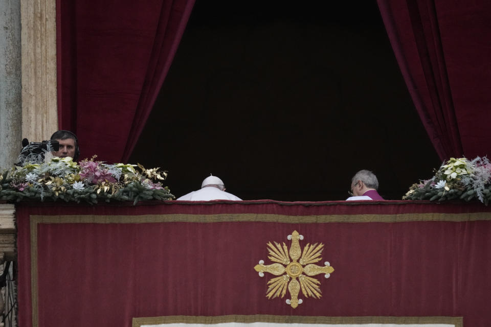 Pope Francis leaves after delivering the Urbi et Orbi (Latin for 'to the city and to the world' ) Christmas' day blessing from the main balcony of St. Peter's Basilica at the Vatican, Monday Dec. 25, 2023. (AP Photo/Gregorio Borgia)