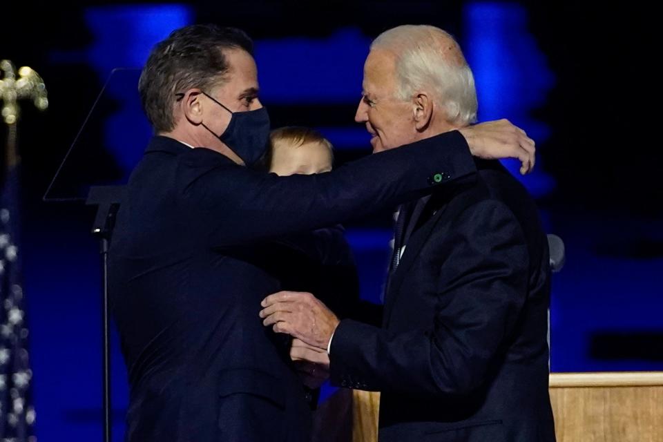 In this Nov. 7, 2020, file photo, President-elect Joe Biden, right, embraces his son Hunter Biden, left, in Wilmington, Delaware.