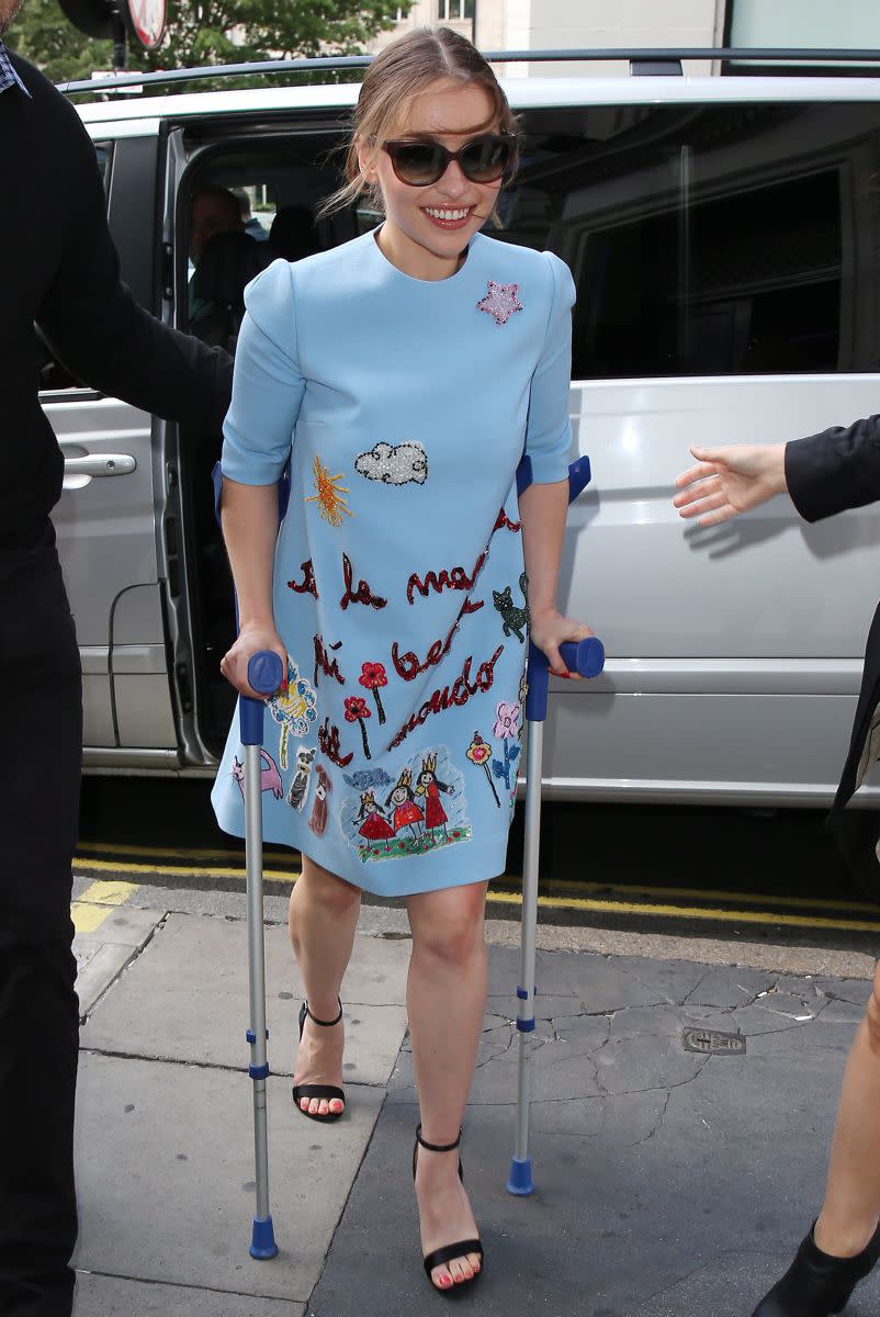 How does she still manage to look so stylish? "Game of Thrones" star Emilia Clarke was spotted heading into an interview in London sporting a vibrant blue dress and a rather unconventional accessory -- a pair of crutches! However, there is speculation that the 28-year-old actress is not injured, and is just using the crutches to stay in character for her new film, "Me Before You."