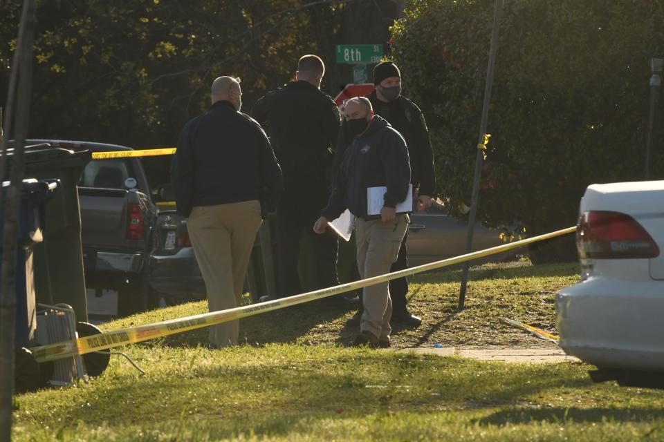 Authorities look over the scene at 7th and Kidder Streets Saturday April 3, 2021. Three people are dead and another four were injured in a mass shooting that took place in Wilmington just after midnight. Gunfire erupted at a house party at 718 Kidder St., according to the Wilmington Police Department. [KEN BLEVINS/STARNEWS]