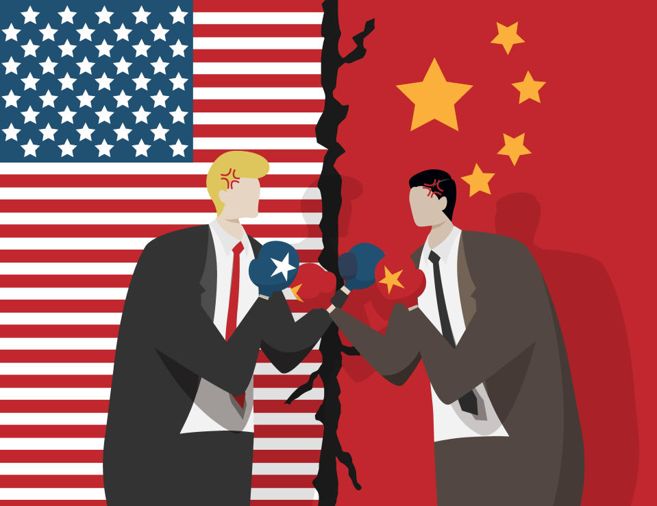 two business people wearing boxing gloves for fight , flag of USA and China at background. trade war between USA and China concept