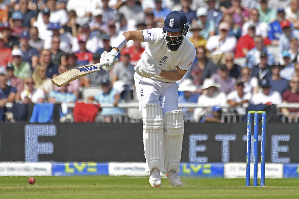 England's Moeen Ali plays a shot during the second day of the fourth Ashes cricket Test match between England and Australia at Old Trafford in Manchester, England, Thursday, July 20, 2023. (AP Photo/Rui Vieira)