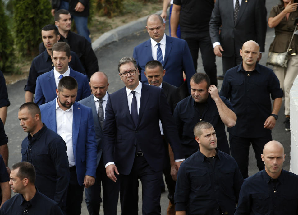 Serbian President Aleksadar Vucic, center, visits a recreation youth center near the village of Gazivode, Kosovo, Saturday, Sept. 8, 2018. Vucic is on a two day visit to Kosovo. (AP Photo/Darko Vojinovic)