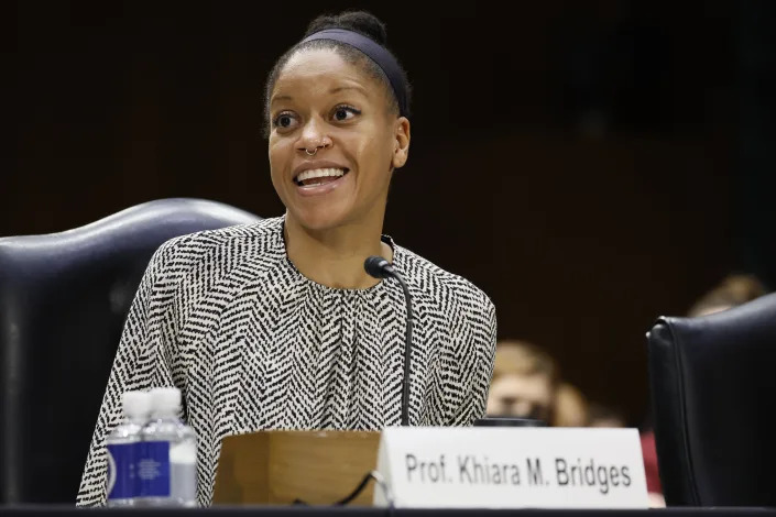 Khiara Bridges, professor of law at the UC Berkeley School of Law, at the microphone.