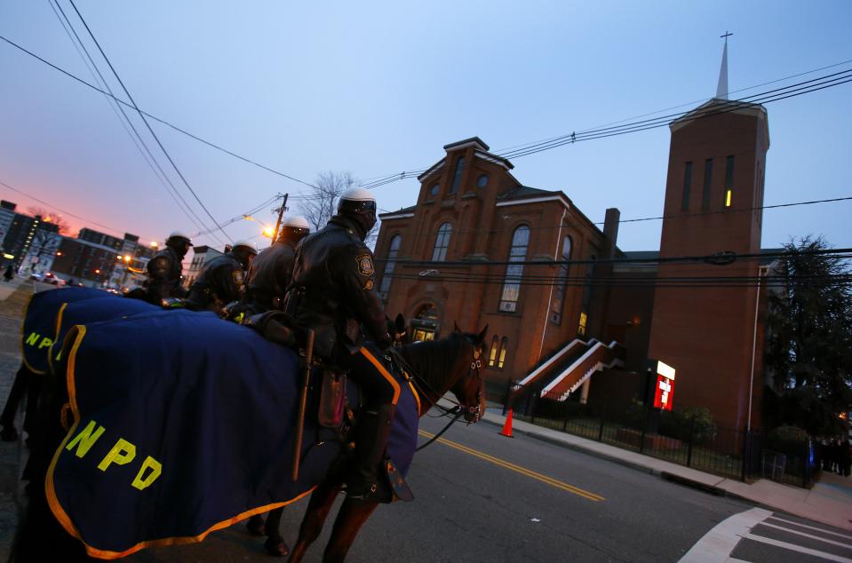 Mounted Newark Police wait outside the New Hope Baptist Church before Governor Chris Christie's inauguration service in Newark, New Jersey, January 21, 2014. Christie, a Republican Party star enmeshed in scandal after re-election in November, will return to the themes of small government and bipartisan cooperation when he is sworn in for a second term on Tuesday. Excerpts from Christie's inaugural address provided by the governor's office made no mention of the abuse of power accusations swirling around some of his closest aides. Instead, the speech criticized the idea that an "almighty government" can "fix any problem." (REUTERS/Adam Hunger)